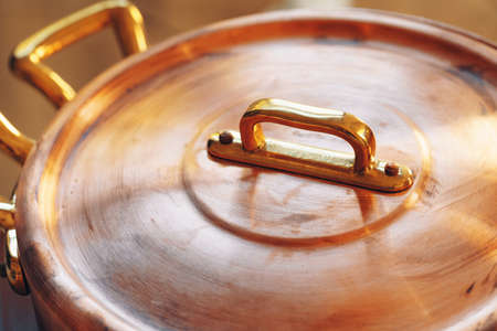 Close up of a set of copper cookware