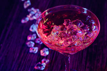 Cocktail drinks with ice in club lightsの写真素材