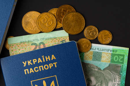 Ukrainian hryvnia banknotes in ukrainian passport close upの写真素材