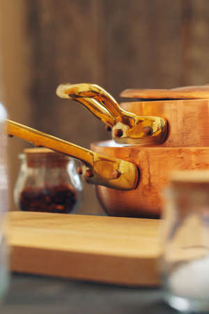 Clean copper cookware in kitchen close upの写真素材