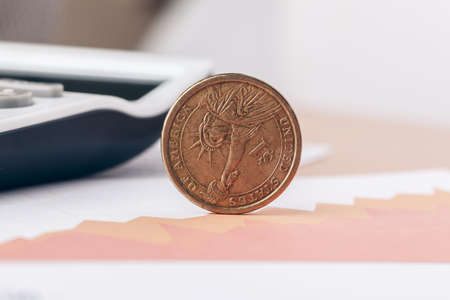 Macro shot of unrecognizable coins stacked close up