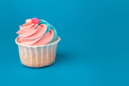 Birthday cupcakes on blue background close upの写真素材