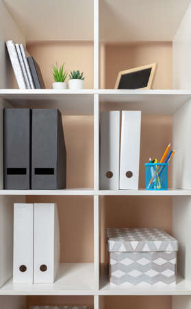 File folders, standing on the shelves at officeの写真素材
