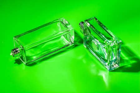 perfume glass bottle on light green background. Eau de toiletteの写真素材