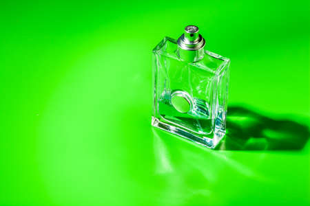 perfume glass bottle on light green background. Eau de toiletteの写真素材