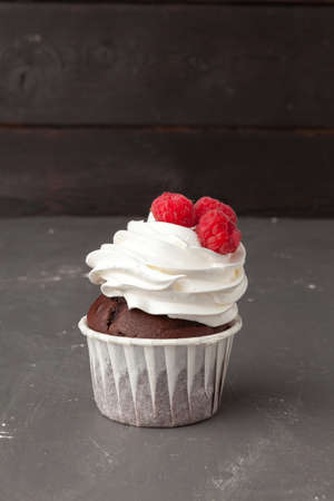 Delicious raspberry cupcakes on dark background - Handmade Sweet dessertの写真素材