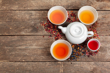 Creative layout made of cup of herbal tea on a wooden backgroundの写真素材