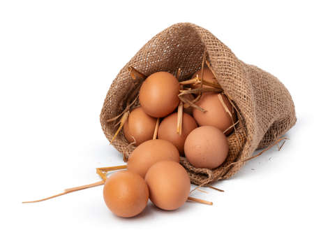 Eggs in basket isolated on white background, close upの写真素材