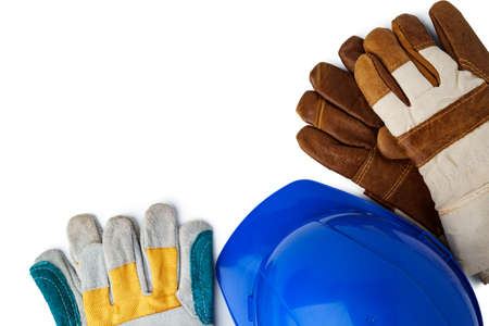 Safety hardhat and work gloves isolated on white background, close upの写真素材