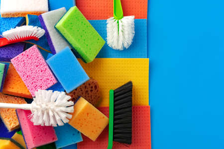 House cleaning supplies on blue color background