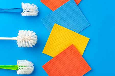 House cleaning supplies on blue color backgroundの写真素材