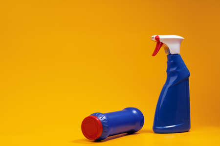 House cleaning detergent bottles on a yellow backgroundの写真素材