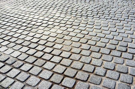 Abstract background of old cobblestone pavement roadの写真素材