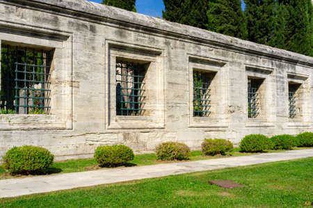 Old stone wall with lattice windows in Suleymaniye Mosque in Istanbul