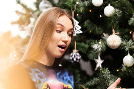 Close up of young blonde beautiful amazed woman looking to the side