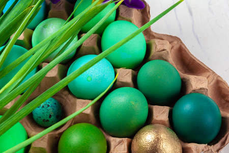 Many Easter eggs decorated with floral branches