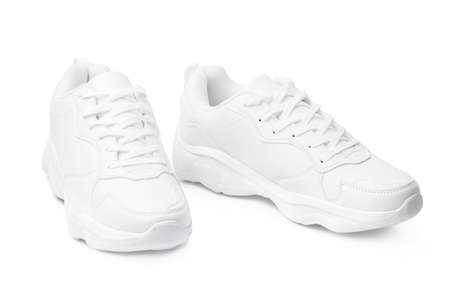 New pair of white sneakers isolated on whiteの写真素材