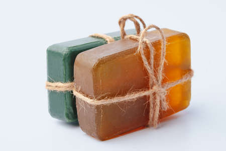 Natural soap bars tied with ribbon isolated on whiteの写真素材