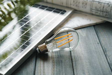 Solar energy panel and light bulb, green energyの写真素材