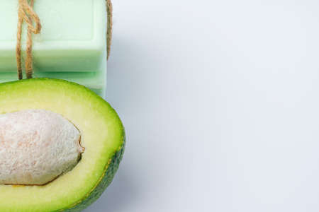 Soap bar with avocado on white backgroundの写真素材