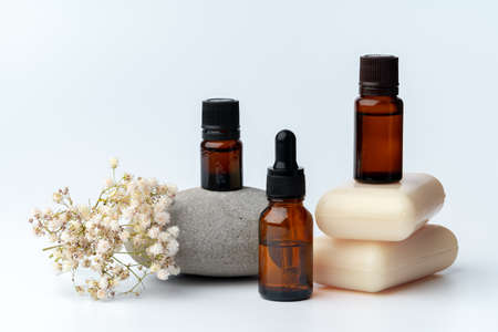 Spa stones and soap on white background