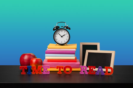 Stack of books on black wooden table