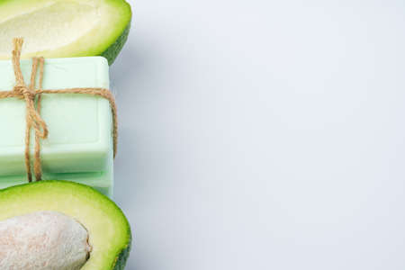 Soap bar with avocado on white backgroundの写真素材