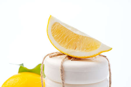 Handmade soap bars and lemon on white background.の写真素材