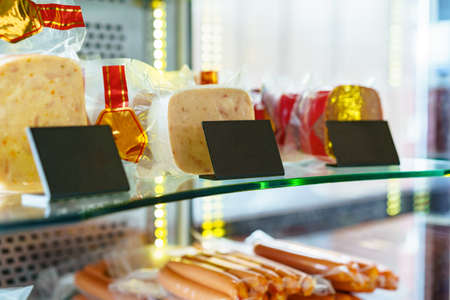 Fresh meat sausages stall at the food shopの写真素材