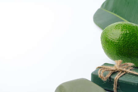 Soap bar with avocado on white background