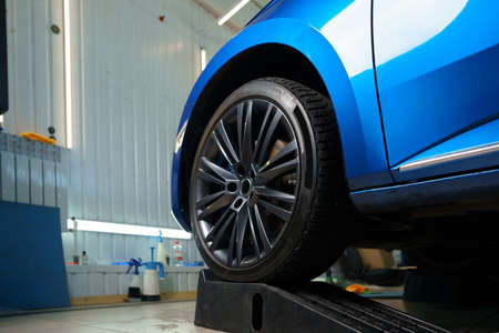 Front wheel of modern blue sport car