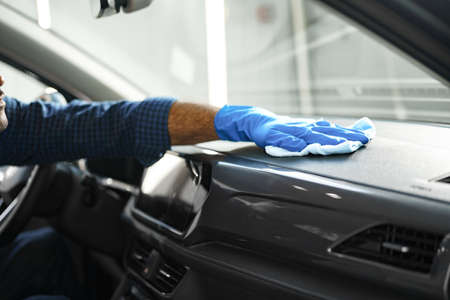 A man cleaning car interior, car detailing in Carwash serviceの写真素材