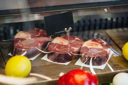 Fresh raw good quality meat on counter in Butcher shop