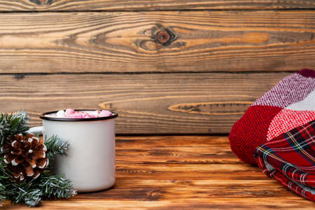 Cup of hot cocoa with marshmallows on wooden backgroundの写真素材