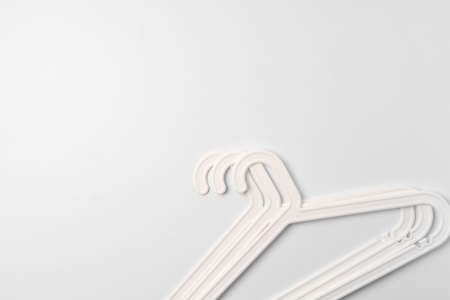 a pile clothes hangers on isolated white backgroundの写真素材