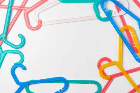 a pile clothes hangers on isolated white backgroundの写真素材