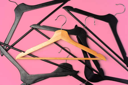 Flat lay composition with empty hangers on pink backgroundの写真素材