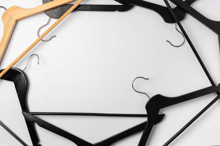 a pile clothes hangers on isolated white background