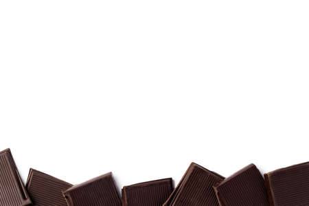 Piece of dark chocolate isolated on white background