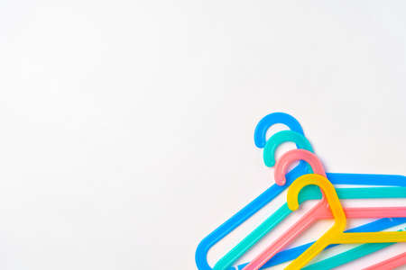 a pile clothes hangers on isolated white backgroundの写真素材