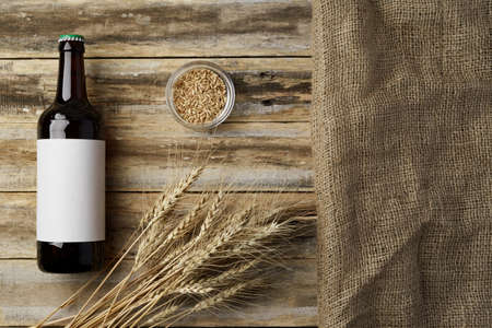 A bottle of beer and grain. Top view. Free space for text.の写真素材