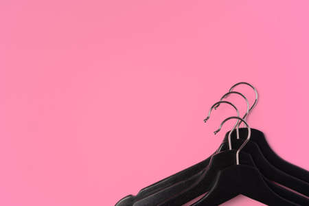 Flat lay composition with empty hangers on pink backgroundの写真素材