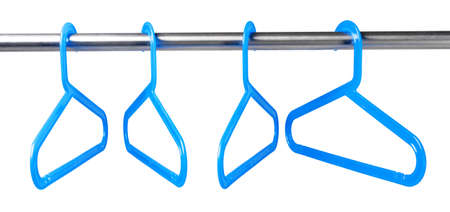 Metal rack with clothes hangers on white backgroundの写真素材