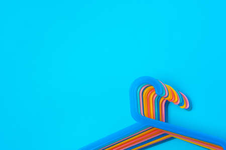 Blue hanger on trendy blue color background. Template fashion blog social media.の写真素材