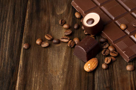 Roasted coffee beans with black chocolate close upの写真素材