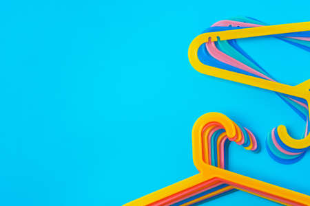 Blue hanger on trendy blue color background. Template fashion blog social media.の写真素材