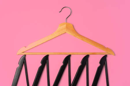 Flat lay composition with empty hangers on pink backgroundの写真素材