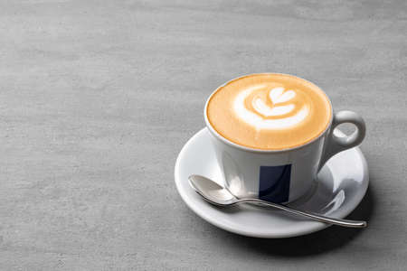 Cup of coffee drink on gray background close up