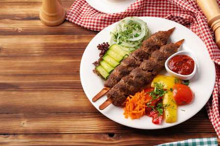 Delicious lula kebab on a wooden tableの写真素材
