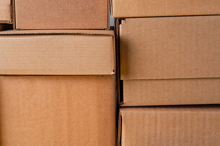 Cardboard boxes stacked in a pile as a background
